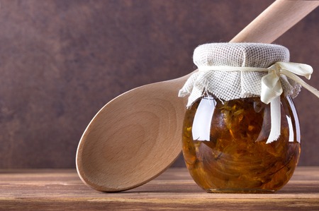 Fruit jam,marmalade in glass on wooden background.の写真素材