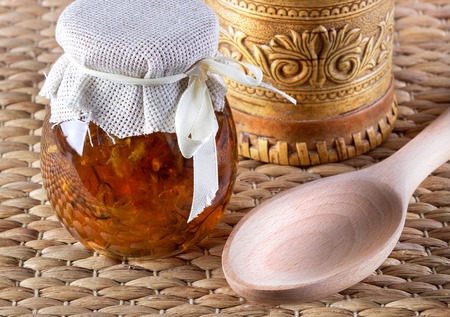 Two jar of honey from flowers on rustic background.の写真素材