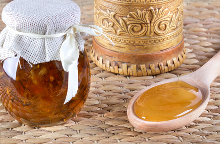 Honey and nuts on rustic tableの写真素材