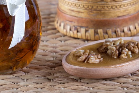 Honey and nuts on rustic tableの写真素材