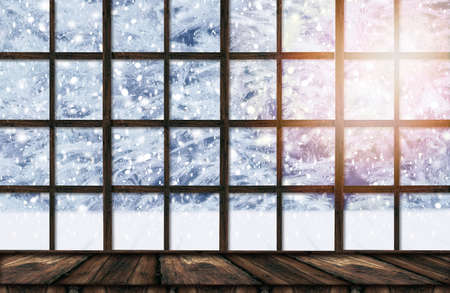 Blurred background of winter window landscape and shabby table place. Winter homely and cozy...
