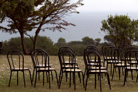 Rows of chairs on a meadow in Sardinia, Italyの写真素材