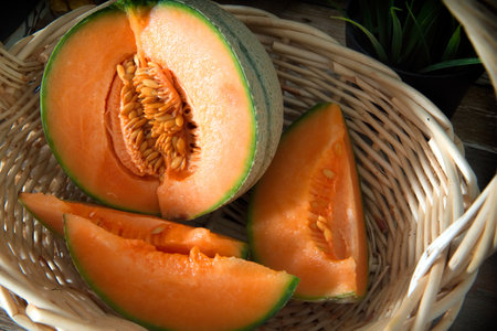 Cantaloupe melon slices in a wicker basket