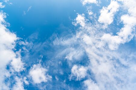 Abstract blue sky background with white clouds.の写真素材