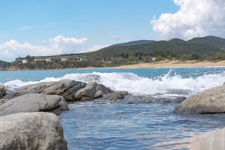 View on waves splashing on rocks from shore. Holiday destination concept. Mediterranean sea.の写真素材