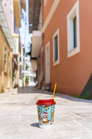 Cup of Mikel coffee at narrow Greek street.