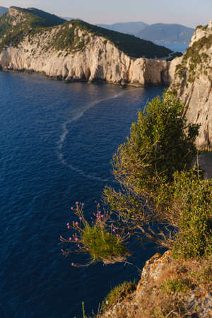 Scenic seascape with stone cliffs of island on background.の写真素材