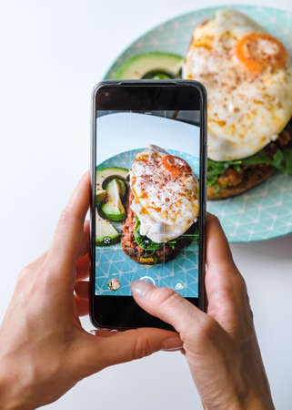 Taking photo of the food for social networks.の写真素材