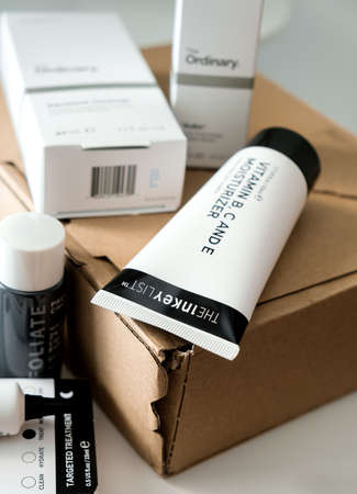 The Inkey List moisturizer with other skin care products on cardboard boxのeditorial素材