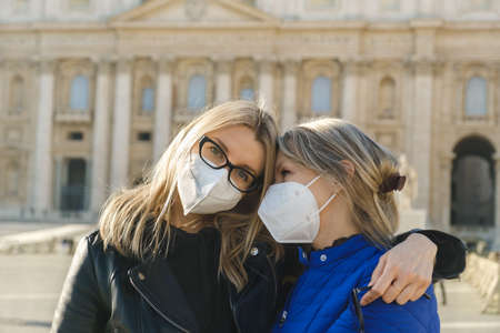 Mother and daughter walking at Vaticanの写真素材