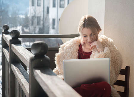 Woman working from home on the balconyの写真素材