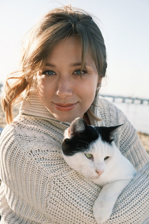 Pet owner and her feline friend.の写真素材