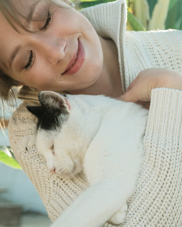 Pet owner and her feline friend.の写真素材