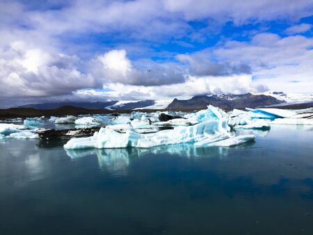 Photo of a broken off glacier part in the glacial lagoon of JÃ¶kulsÃ¡rlÃ³n, in the south of...