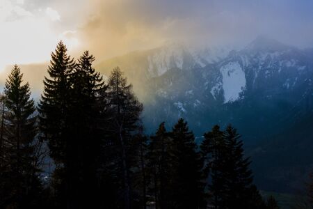 Colorful sunset on a snowy winter day in the swiss alps