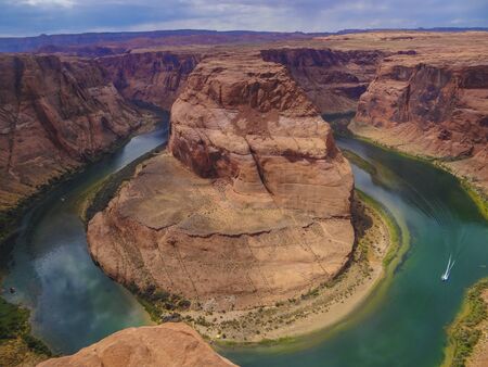 The Horseshoe Bend near Page in the US state of Arizona on a summer day with lots of colorsの写真素材
