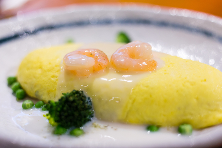 Omelet wrapped rice with prawnの写真素材