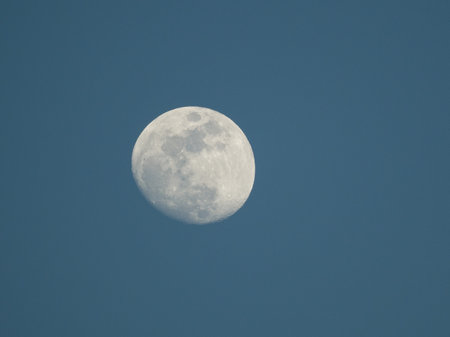 Full moon in the blue sky, closeup of photo with selective focusの写真素材