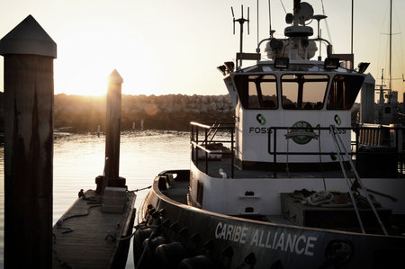 Fishing boat in the harbor at sunset. Sunset in the port.の写真素材