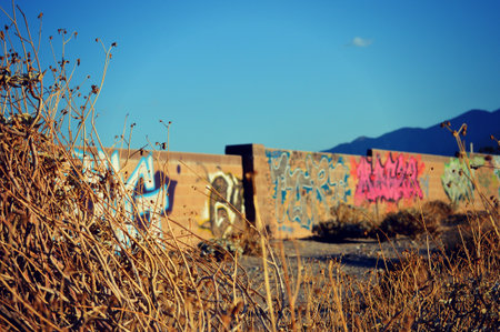 Graffiti on the wall of an abandoned building in the desert.の写真素材