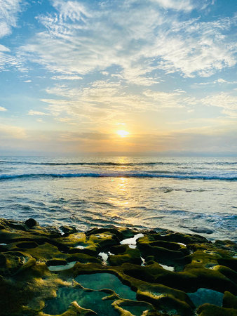 Sunset next to tide pools beach in La Jolla, CA. Beautiful nature background.の写真素材