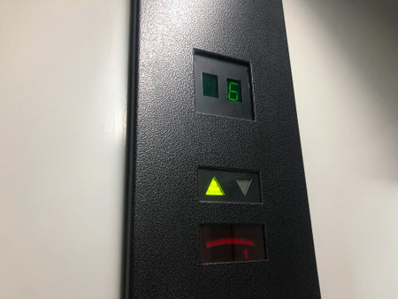 Electronic led elevator display showing the lift moving up to the sixth floor. The elevator is equipped with an automatic weight recognition system so as not to overload lift and to use it safely.の写真素材