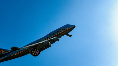 Toy plane soaring into the skyの素材