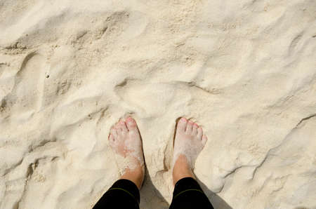 Foot on sand at the beach,top viewの写真素材