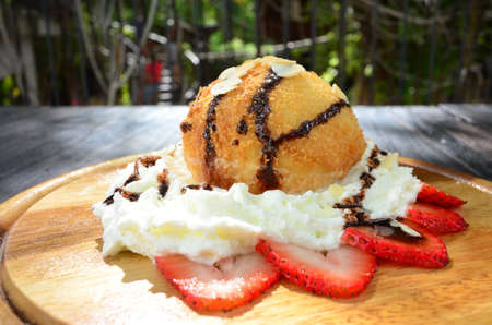 Fried Ice Cream on wood plateの写真素材
