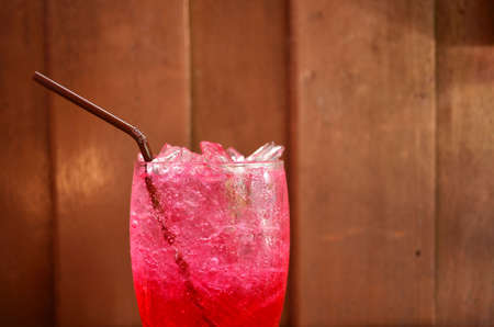 Red soda water on wood backgroundの写真素材