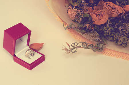ring in red box with flower on white background vintage tone