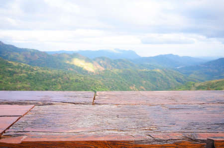 Wood bar with mountain view and skyの写真素材