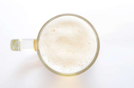 Top view on beer glass on white backgroundの写真素材