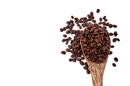 Coffee seed in a spoon on white background