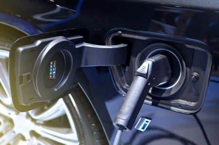 Electric car charging at stationの写真素材