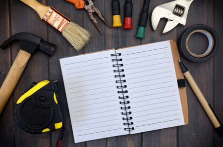 Technician toosl and note on wood backgroundの写真素材
