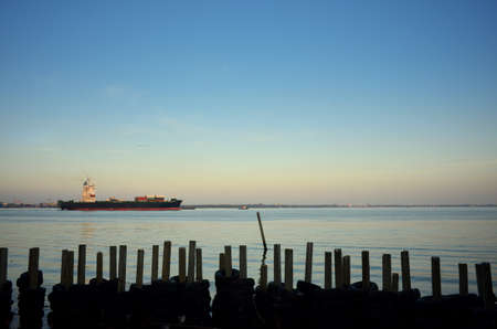 Large container ship arriving in port.