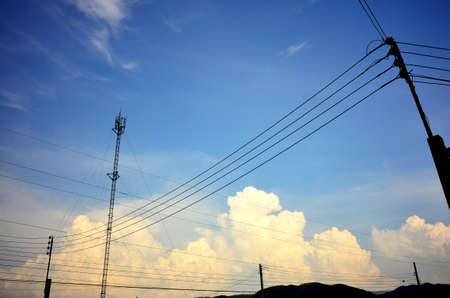 Electricity post with cloudの写真素材
