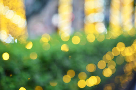 Light gold bokeh on green background texture
