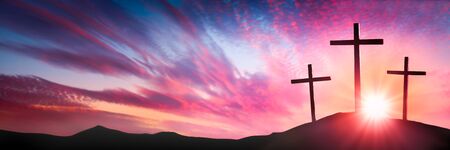 Three Wooden Crosses On Calvary's Hill At Sunrise - Crucifixion And Resurrection Of Jesus Christ Conceptの写真素材