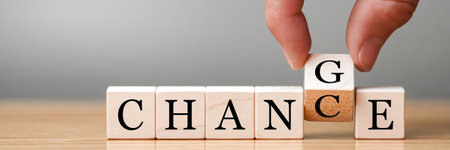 Hand flip wooden cube with word change to chance, Personal development and career growth or change...