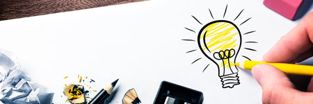 Creative drawing of a lightbulb with crumpled paperの写真素材