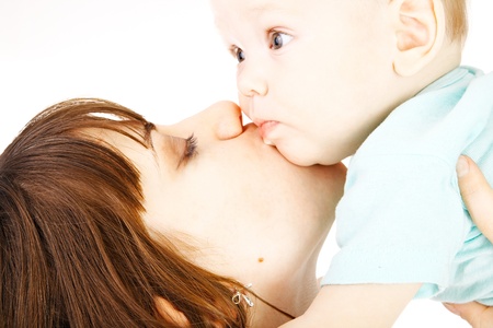 happy mother with baby over white backgroundの写真素材