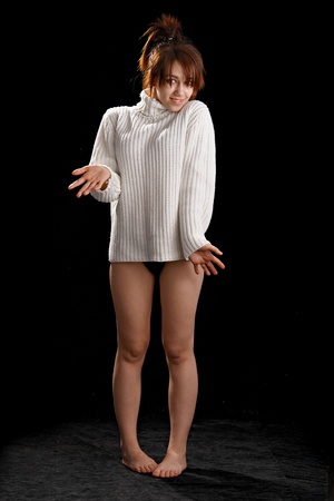 Fashion portrait of young beautiful woman on dark backgroundの写真素材