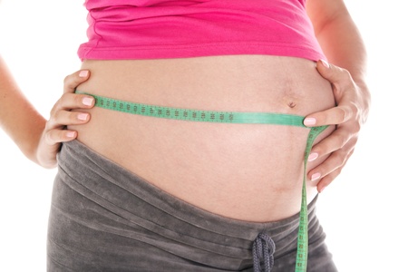 expectant mother measures abdomenの写真素材