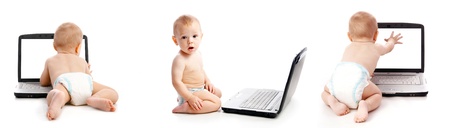 Infant using laptop over whiteの写真素材