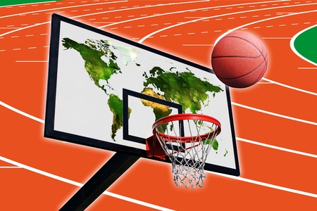 a basketball and a panel of basketball with a world map on a background of running trackの写真素材