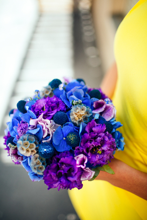 Bride holding the bouguet of beautiful flowersの写真素材