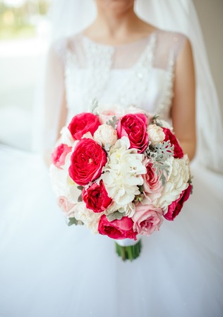 Bride holding the bouguet of beautiful flowersの写真素材