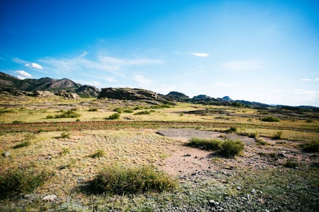 Road in mountains and prarie in Kazakhstan, Asiaの写真素材